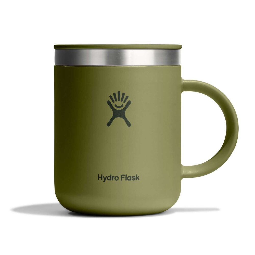 Green Hydro Flask insulated mug with handle, fitted sip lid, stainless-steel band at top, matte finish, and Hydro Flask logo on front. White background.
