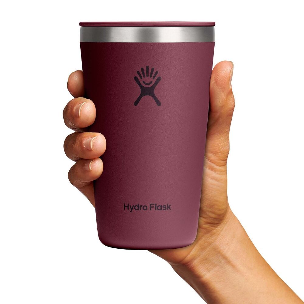 Maroon Hydro Flask insulated tumbler with stainless-steel rim, matching lid with sip slider, smooth matte tapered finish, and Hydro Flask logo on front.